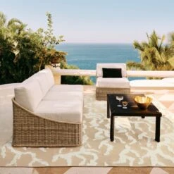Nino Ivory Rattan Outdoor Lounge Chair With Ivory Boucle Sunbrella® Cushions 12 Nino Ivory Rattan Outdoor Lounge Chair With Ivory Boucle Sunbrella® Cushions -Cb2 CB2SU23 RC 06B HERO V2
