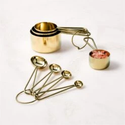 Dose Champagne Gold Measuring Cups 7 Dose Champagne Gold Measuring Cups -Cb2 DoseChampagneGoldGroupFHF22 1