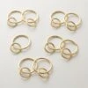 Polished Brass Curtain Rings Set Of 9 1 Polished Brass Curtain Rings Set Of 9 -Cb2 DraperyRingsPlshdBrassS9AVSHF21
