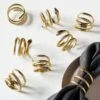 Slink Gold Napkin Rings Set Of 8 -Cb2 SlinkGoldNapkinRingS8SHF20